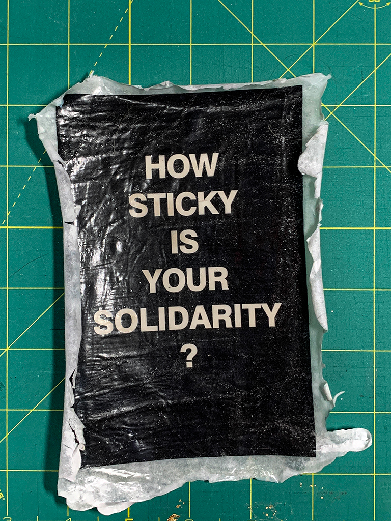 postcard with the words How Sticky is you Solidarity